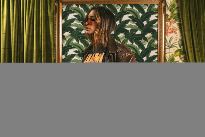 A model wears black Duvin apparel.